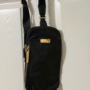 Tumi Black Belt Bag with Gold Accents